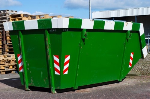 Worker placing a permit on a parking bay for skip placement